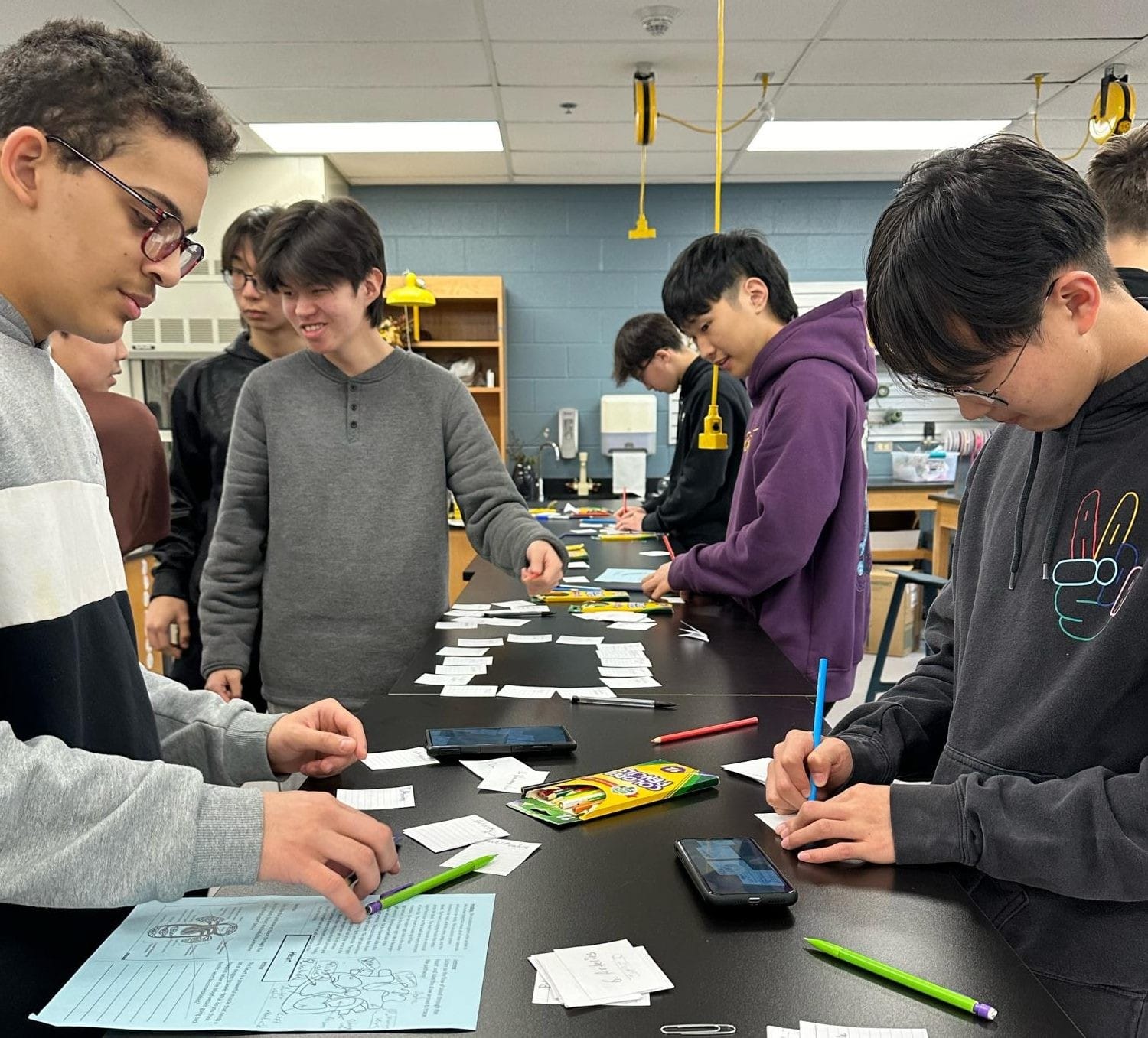 Class in session: Students from the Block 4 Language Assisted (LA) Biology work together to make vocabulary photo cards. Next year, the two LA Science classes
